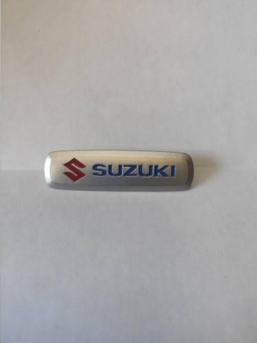Эмблема шильдик метал. Suzuki /6,5 х 1,8 см/ матовый